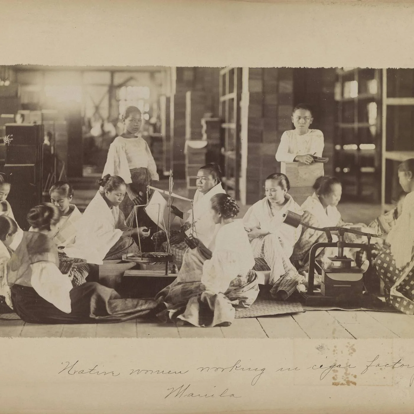 Women rolling cigars in a Manila factory, archive photograph