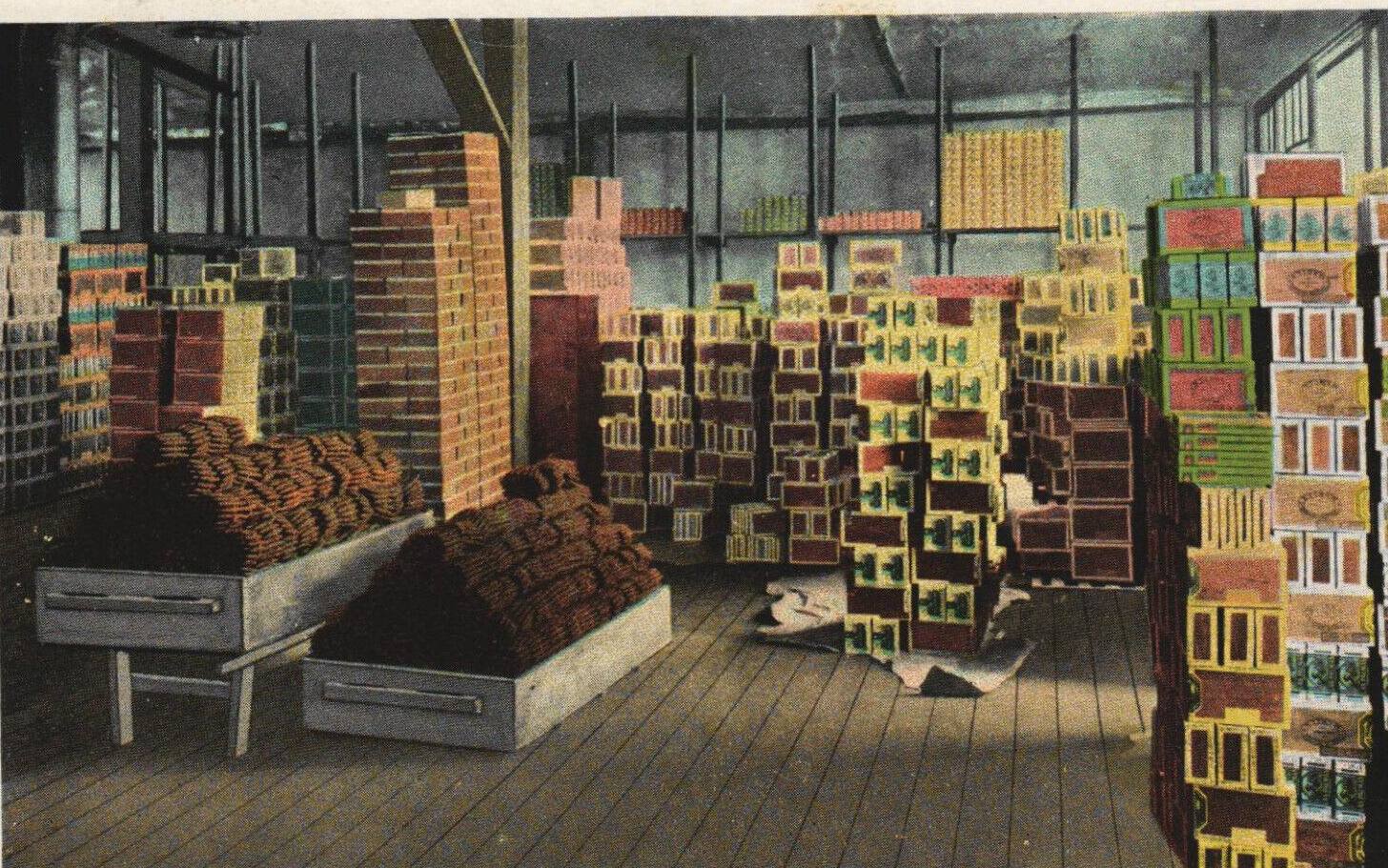 Boxes stacked in a Philippine cigar factory, vintage postcard