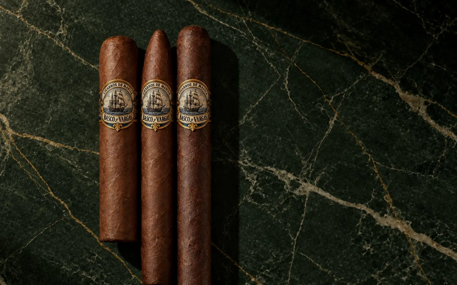 Three Basco y Vargas cigars on green marble